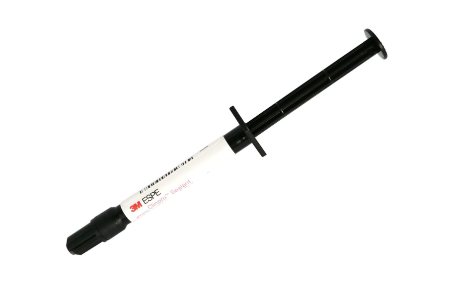 A 3M ESPE dental composite filling syringe with black plastic plunger and tip, and a white label, shown diagonally on a plain white background.